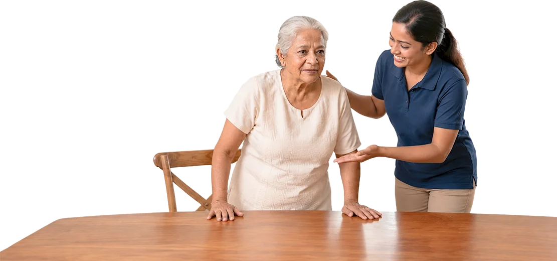 A caregiver helping an elderly woman stand from a chair